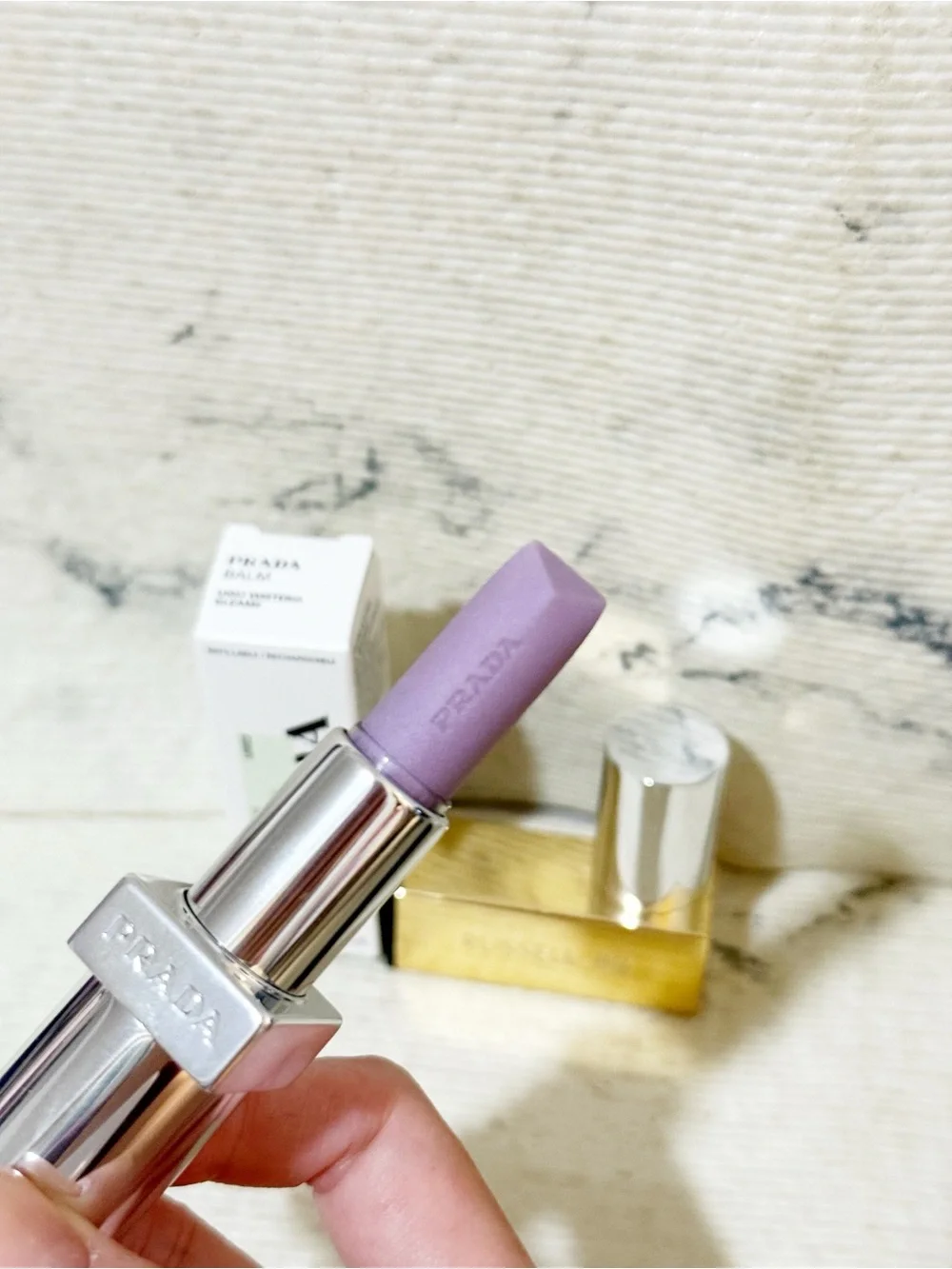 Prada Balm in U003 Wisteria Gleams PH Pinky Lilac Finish with Iridescent Shimmer